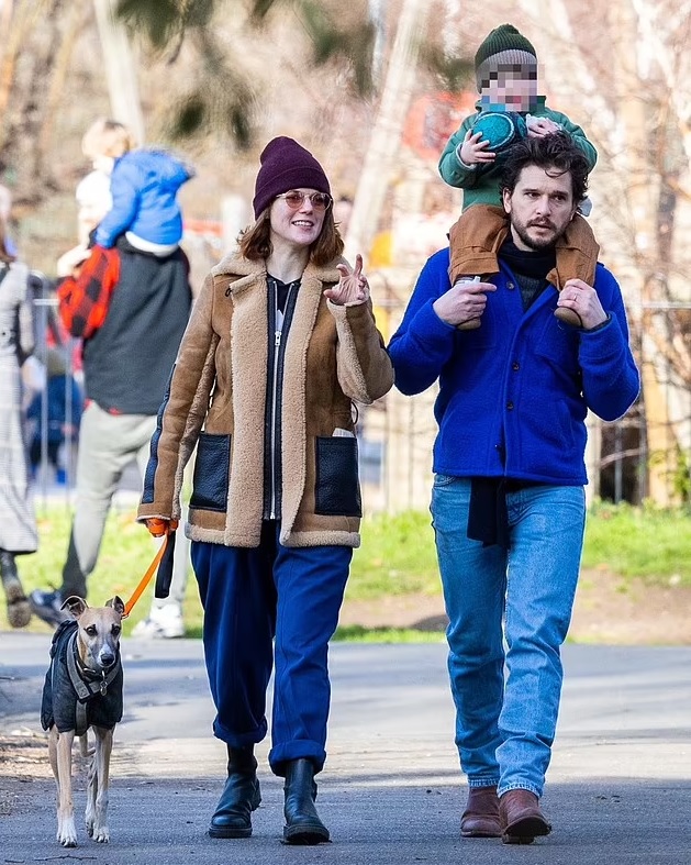Kit Harington and his wife Rose Leslie out on a walk with their son