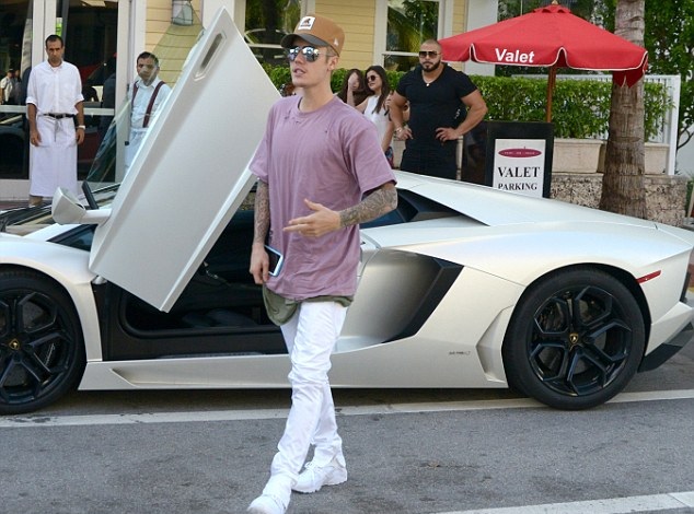 Justin Bieber pictured in front of his Lamborghini