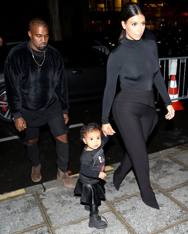 North West as a toddler with her parents Kanye West and Kim Kardashian