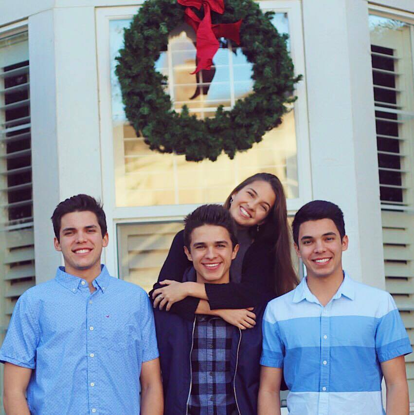 Lexi Rivera with all three of her brothers