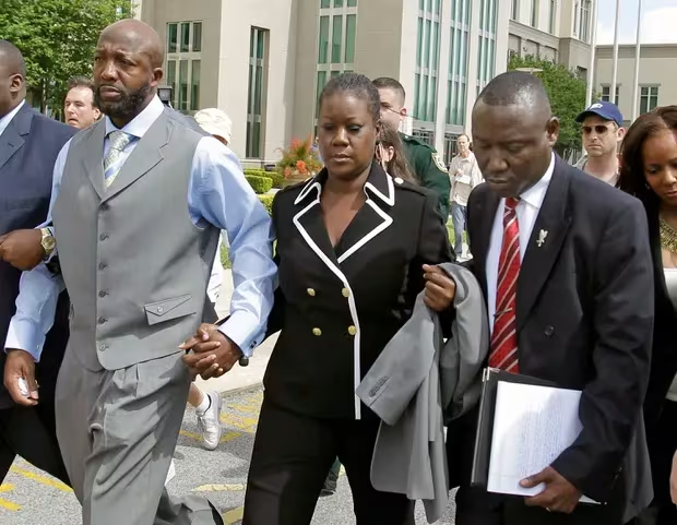 Ben Crump leaving the Seminole County Criminal Justice Center with Trayvon Martin's parents